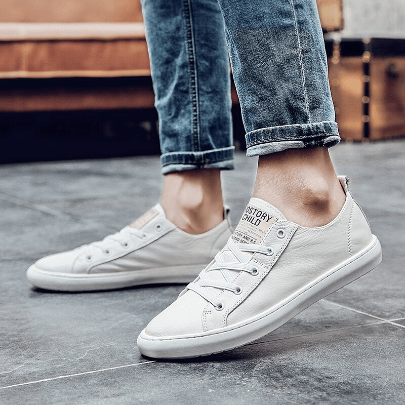 Luxury genuine leather walking shoes for men, casual breathable with rubber outsole, shown worn with jeans in a stylish setting